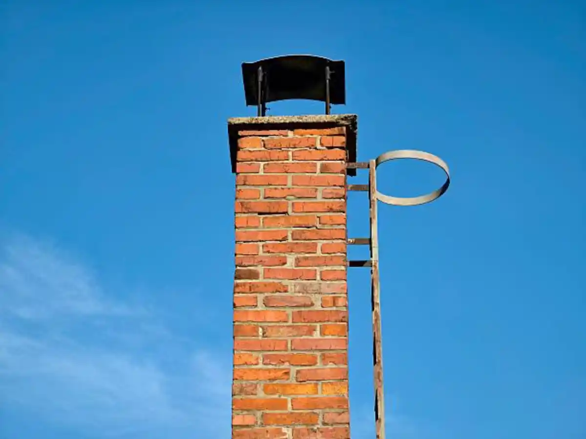 Chimney stack rising above a roof in Aurora